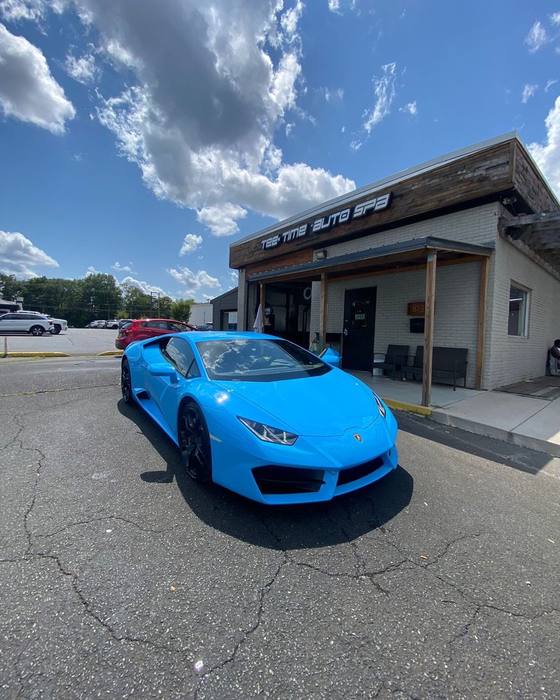 Bright blue Lamborghini Huracan at the shop