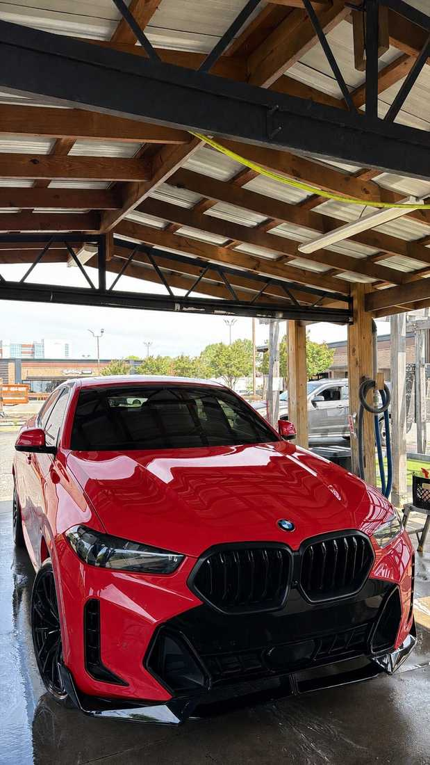 Glossy red BMW X6 freshly detailed at Tee Time Auto Spa, Charlotte, NC
